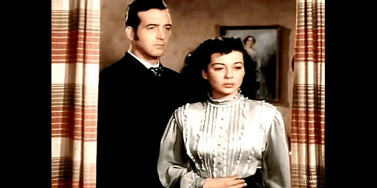 John Payne as Clay Fletcher and Gail Russell as Susan Jeffers reacting to the sight of her father coming home drunk again in El Paso (1949)