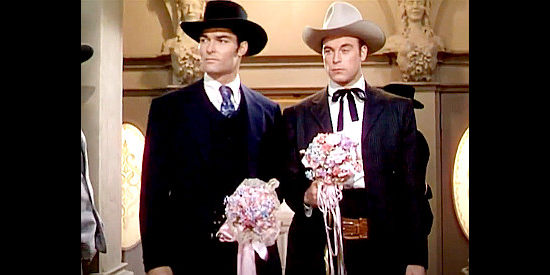 John Russell as Grant O'Hara and Scott Brady as Lee O'Hara, feuding cousins vying for the same gal in The Gal Who Took the West (1949)