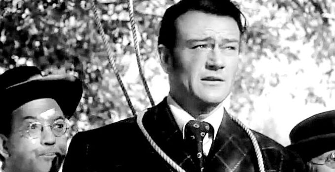 John Wayne as Tom 'Boston' Craig, a pharmacist in a heap of trouble In Old California (1942)