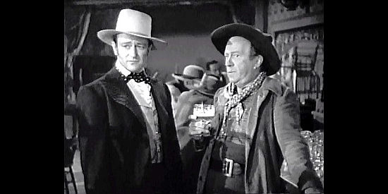 John Wayne as Tom Craig and Edgar Kennedy as Kegs McKeever, running out of places to set up shop in In Old California (1942)