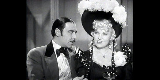 Joseph Calleia as Jeff Badger, under the spell of Flower Belle Lee (Mae West) in My Little Chickadee (1940)