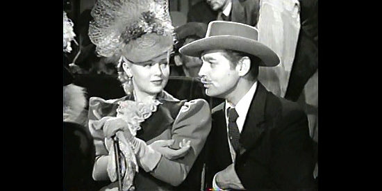 Lana Turner as Lucy Cotton, about to trick Candy Johnson (Clark Gable) out of $10 for a good cause in Honky Tonk (1941)