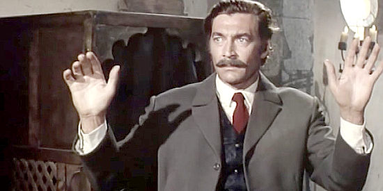 Luis Davila as McDermott, the gun dealer with too many buyers in Pancho Villa (1972)