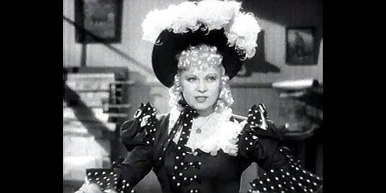 Mae West as Flower Belle Lee, turning heads with her curves and her flirting in My Little Chickadee (1940)