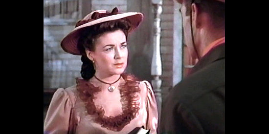 Marguerite Chapman as Kate Hardison, warning Chris Denning about the cost of living on hate in Coroner Creek (1948)