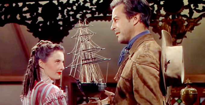 Barbara Stanwyck as Lily and Ray Milland as Jonathan Trumbo, sharing stories of a slave-trading past in California (1947)