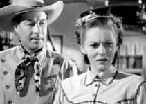 Bill Elliott as Gary Conway with Lorna Gray as Connie Faulker, realizing her dispatches are being alterred to make the Texas Rangers look bad in The Gallant Legion (1948)