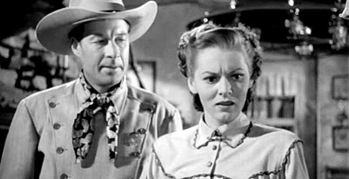 Bill Elliott as Gary Conway with Lorna Gray as Connie Faulker, realizing her dispatches are being alterred to make the Texas Rangers look bad in The Gallant Legion (1948)