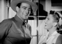 John Wayne as Duke Hudkins and Jean Arthur as Molly J. Truesdale in Lady Takes a Chance (1943)