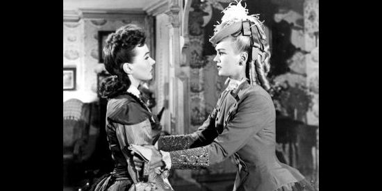 Patricia Knight (right) as Josie Allen, begging Alice Sharp (Catherine McLeod) for information in The Fabulous Texan (1947)