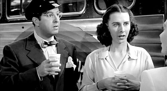 Phil Silvers as tour leader Smiley Lambert and Mary Field as tourist Florrie Bendix in A Lady Takes a Chance (1943)