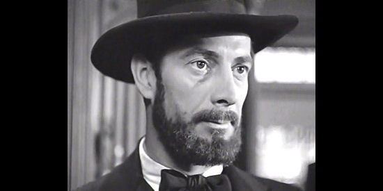 Reed Hadley, as Jesse James in the middle of a bank robbery in I Shot Jesse James (1949)