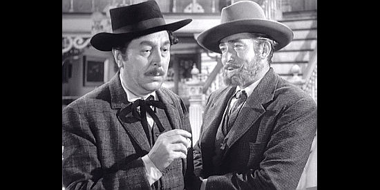 Reginald Gardiner as Grover Walsh getting a warning from saloon manager Al Shanks (Roy Roberts) in Fury at Furnace Creek (1948)