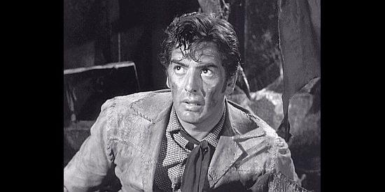 Victor Mature as Cash Blackwell, pinned down in a tight spot in Fury at Furnace Creek (1948)