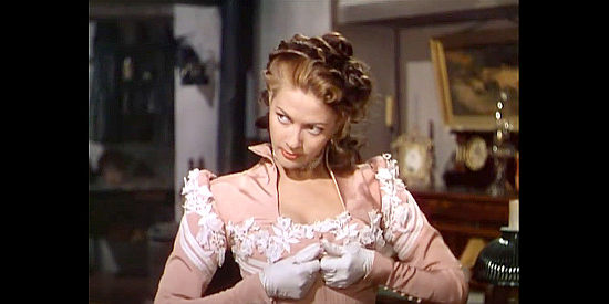 Yvonne De Carlo as Lillian Marlowe, threatening to undress and feign assault in The Gal Who Took the West (1949)