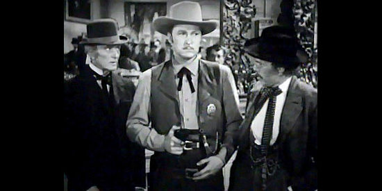 Albert Dekker as Bat Masterson, trying to bring calm to the rowdy cowtown of Dodge in The Woman of the Town (1943)