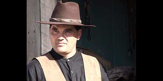 Angelo Ortega as Sheriff Tom Peavy, a lawman with a string of murders to solve in Sheriff of Contention (2010)