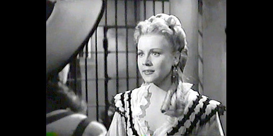 Anne Jeffreys as Ruby Stone, a saloon girl in love with Logan Maury in Trail Street (1947)