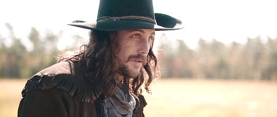 Ben Robson as Luke McCabe, a bounty hunter spotting his prey in Emperor (2020)