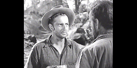 Bruce Bennett as James Cody, trying to become the fourth partner in a gold strike in The Treasure of the Sierra Madre (1948)
