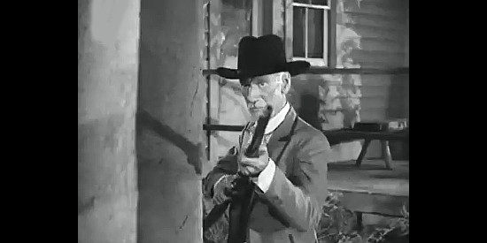Clem Blevans as Tadpole Foster, ready to lend a hand to the Earps if necessary in Tombstone, the Town Too Tough to Die (1942)