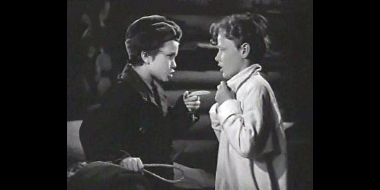 Darryl Hickman as young Blackie and Drew Roddy as young Jim, best friends parting ways in Northwest Rangers (1942)