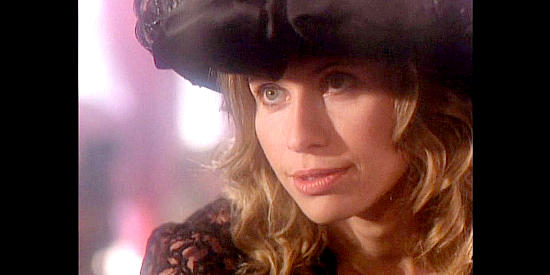 Elizabeth Kaitan as Delia Westwood, on a bender and warning Lily about men in Petticoat Planet (1996)