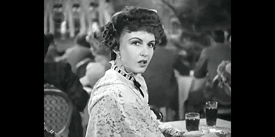 Frances Gifford as Ruth Grant, wondering if Johnny is really going straight for good in Tombstone, the Town Too Tough to Die (1942)