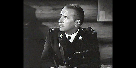Frederick Worlock as Inspector Cannady, presiding over Pierre's hearing in Pierre of the Plains (1942)