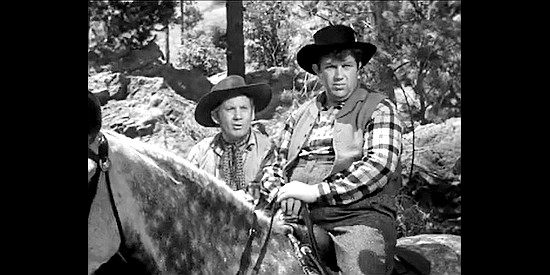 Fuzzy Knight as Hurricane Harry and Andy Devine as Spearfish, on the watch for trouble in Badlands of Dakota (1941)