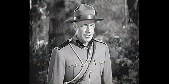 Jack Holt as Sgt. Duncan Frazier, the Mountie who raises Jim and Blackie in Northwest Rangers (1942)