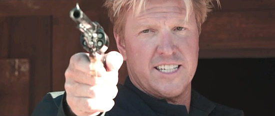 Jake Busey as Capt. McCalister, suspicious of Briggs' activities in A Soldier's Revenge (2020)