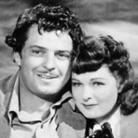 John Carroll as Pierre and Ruth Hussey as Daisy Denton in Pierre of the Plains (1942)