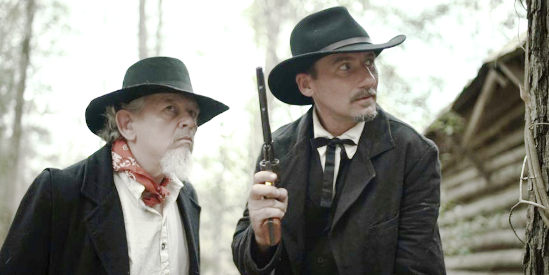 Joseph Zuchowski as railroad worker Jedidiah and Paul Clayton as Wyatt Earp after their man in Wyatt Earp Shoots First (2019)