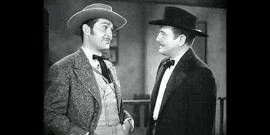 Kent Taylor as Doc Holiday and Richard Dix as Wyatt Earp, old friends getting reacquainted in Tombstone, the Town Too Tough to Die (1942)