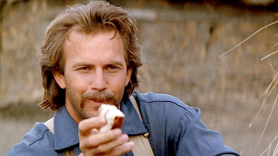 Kevin Costner as Lt. John Dunbar, trying to win the confidence of a wolf named Two Socks in Dances with Wolves (1990)