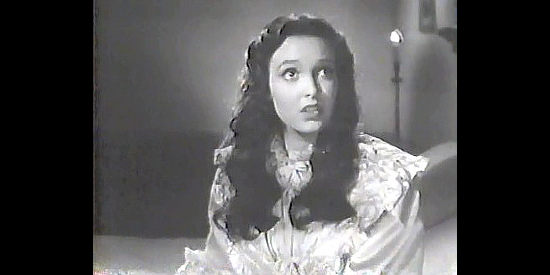 Linda Darnell as Lolita Quintero, discusssing marriage to Don Diego with the jealous Inez in The Mark of Zorro (1940)