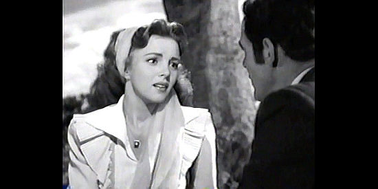 Madge Meredith as Susan Pritchett, wondering whether it's worth staying in Kansas in Trail Street (1947)