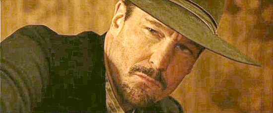 Michael Eklund as Roland Bursley, the mercenary who killed his own brother in the Civil War in West of Hell (2018)