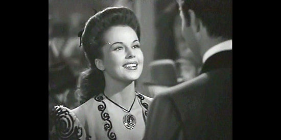 Patricia Dane as Jean Avery, introducing herself to Blackie Marshall in Northwest Rangers (1942)