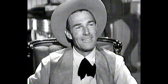 Randolph Scott as Bat Masterson, listening to Maury's proposal that they join forces in Trail Street (1947)