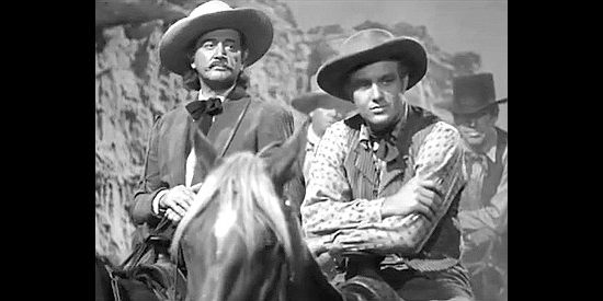Richard Dix as Wild Bill Hickok and Robert Stack as Jim Holliday prepare a trap for the bandits in Badlands of Dakota (1941)