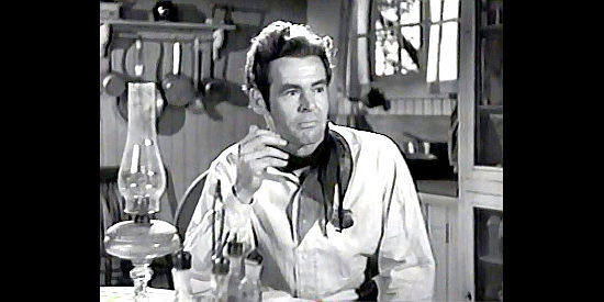 Robert Ryan as Allan Harper, spotting the secret to his dreams of a prosperous Kansas farming community in Trail Street (1947)