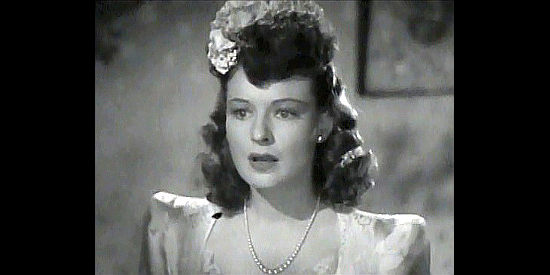 Ruth Hussey as Daisy Denton, surprised at the ploy that disrupts her planned marriage in Pierre of the Plains (1942)