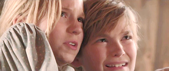 Savannah Judy as Grace and Luke Judy as Ethan, fearful of the man they've sought for help in A Soldier's Revenge (2020)
