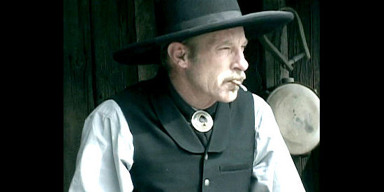 Steve Johnson as Dave Riley, the oft-drunk cowboy suspected of murdering women in Sheriff of Contention (2010)
