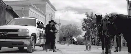 The Earps and Doc Holliday arrive at the O.K. Corral in their police car and prepare to square off against the cowboys in Tombstone Rashomon (2017)