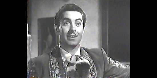 Tyrone Power as Don Diego Vega, revealing his alter ego to Lolita in The Mark of Zorro (1940)