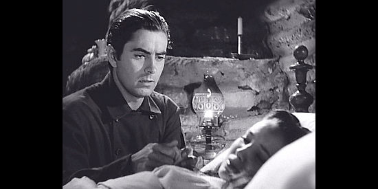 Tyrone Power as Jonathan Kent, trying to nurse Zina back to health in Brigham Young (1940)