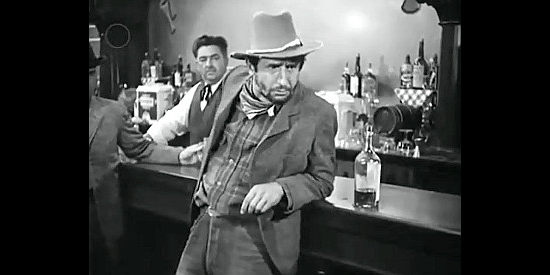 Victor Jory as Ike Clanton, talking tough with the Earps in Tombstone, the Town Too Tough to Die (1942)